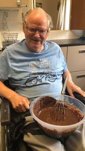 Man in wheelchair with cake mix