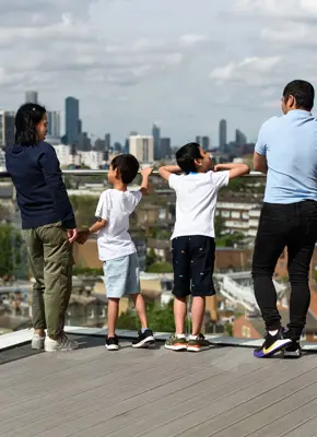 Man, woman and two children on balcony