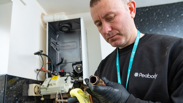 Man cleaning a pipe