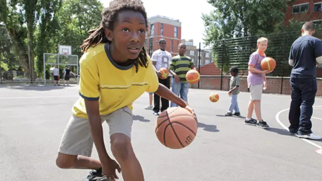 Boy playing with a basketball