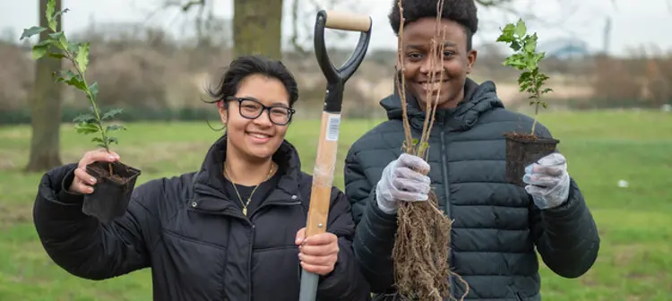 Young people with gardening tools